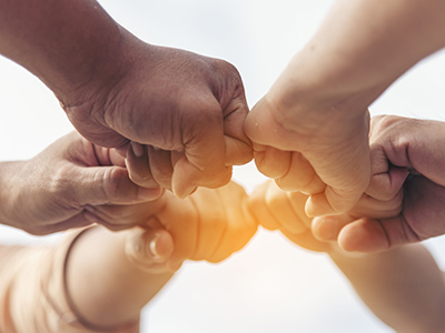 Close up hands Teamwork group of multi racial people meeting join hands. Diversity people hands join empower partnership teams connect volunteer community. Diverse multiethnic Partners team together Doctor and nurse sitting on sofa